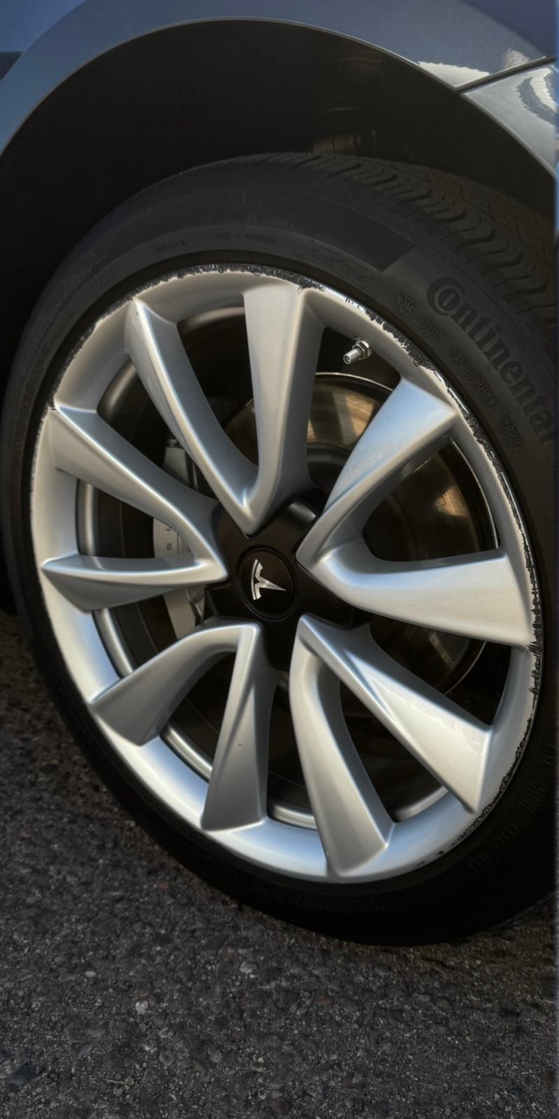 Tesla wheel before repair