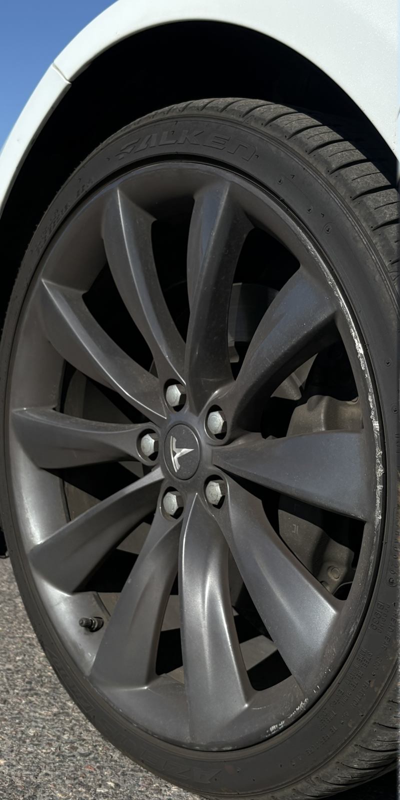 Tesla wheel before repair